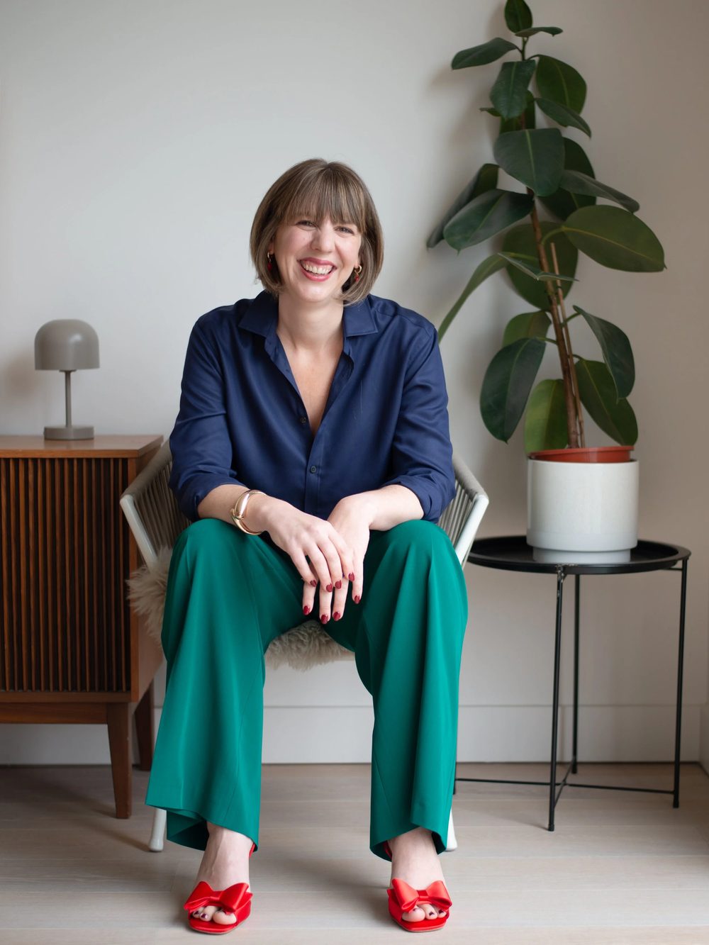 Sophie Griffiths sitting on a chair, smiling